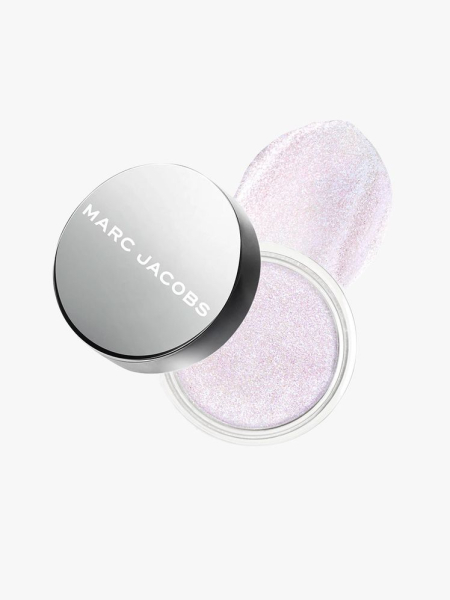 Container of Marc Jacobs Beauty Money Shot Highlighter  with silver cap on light gray background 